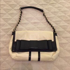 Kate Spade cream leather clutch with black bow EUC